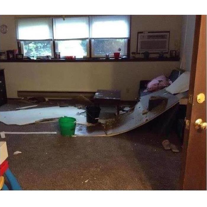 picture of a basement where the ceiling has collapsed